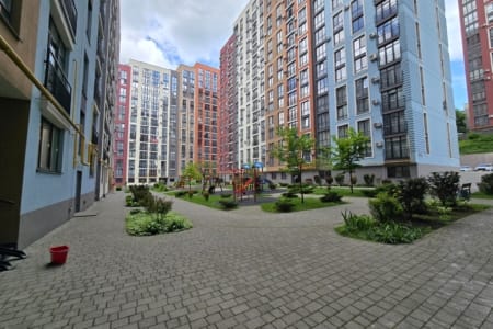 Courtyard of the Semytsvit residential complex with flower beds and paths