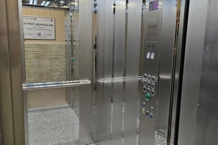 Modern lift in the entrance hall of the building in the Semytsvit complex