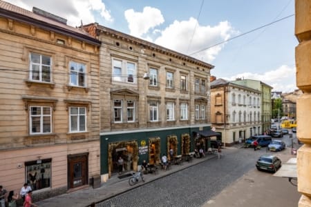 Window view of the historic buildings of Krakivska Street in Lviv