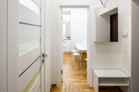 View from the hallway into the kitchen with a dining table, Krakivska Street apartment