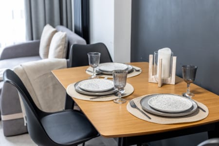 Dining table set for four in the apartment in the Semytsvit complex