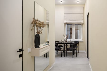Hallway with a mirror and a view of the dining area in the apartment on Doroshenka Street
