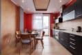 Kitchen with a dining area and balcony access in the apartment on Pluhova Street