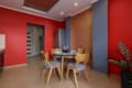 Round dining table with wooden chairs in the kitchen of the apartment on Pluhova Street