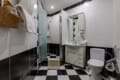 Bathroom with a shower cabin, washbasin and toilet in the apartment on Pluhova Street